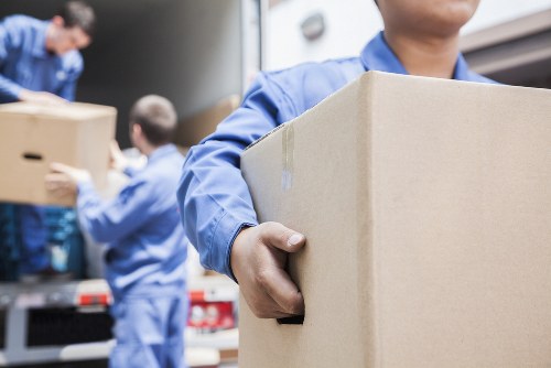 Moving van and packed boxes for removals in Isleworth