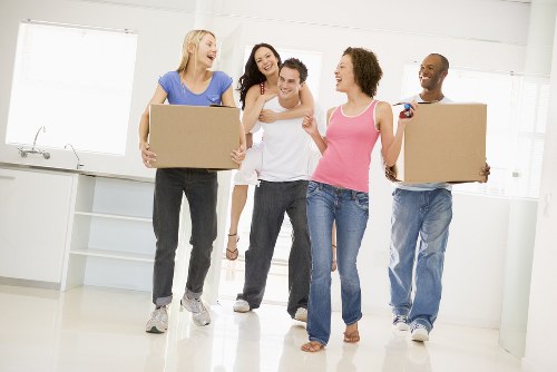 Removal van and moving boxes ready for a home move in Isleworth
