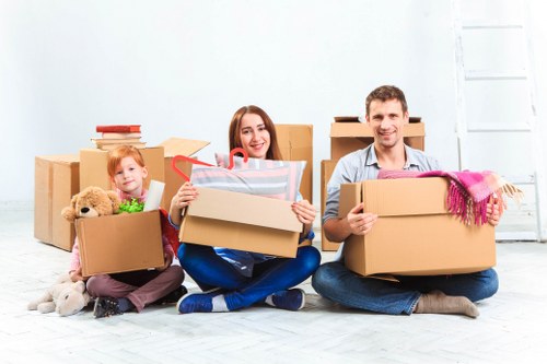 Removal van and moving team in an Isleworth residential street