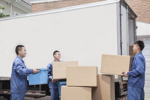 Local removals team handling furniture for an Isleworth home