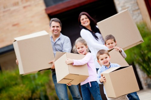 Moving crew handling furniture in a local Isleworth property