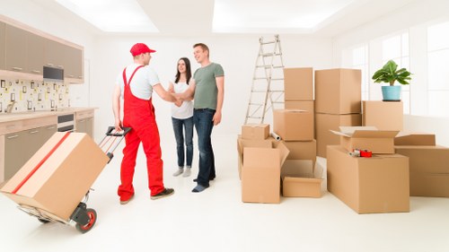 Unpacking support helping a family settle into a new Isleworth home