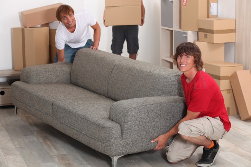Local movers handling retail equipment during a commercial move