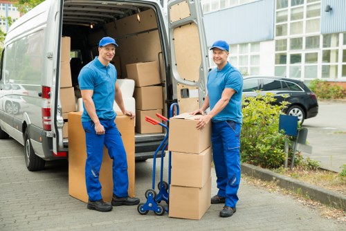 Packing boxes and furniture prepared for removal van transport